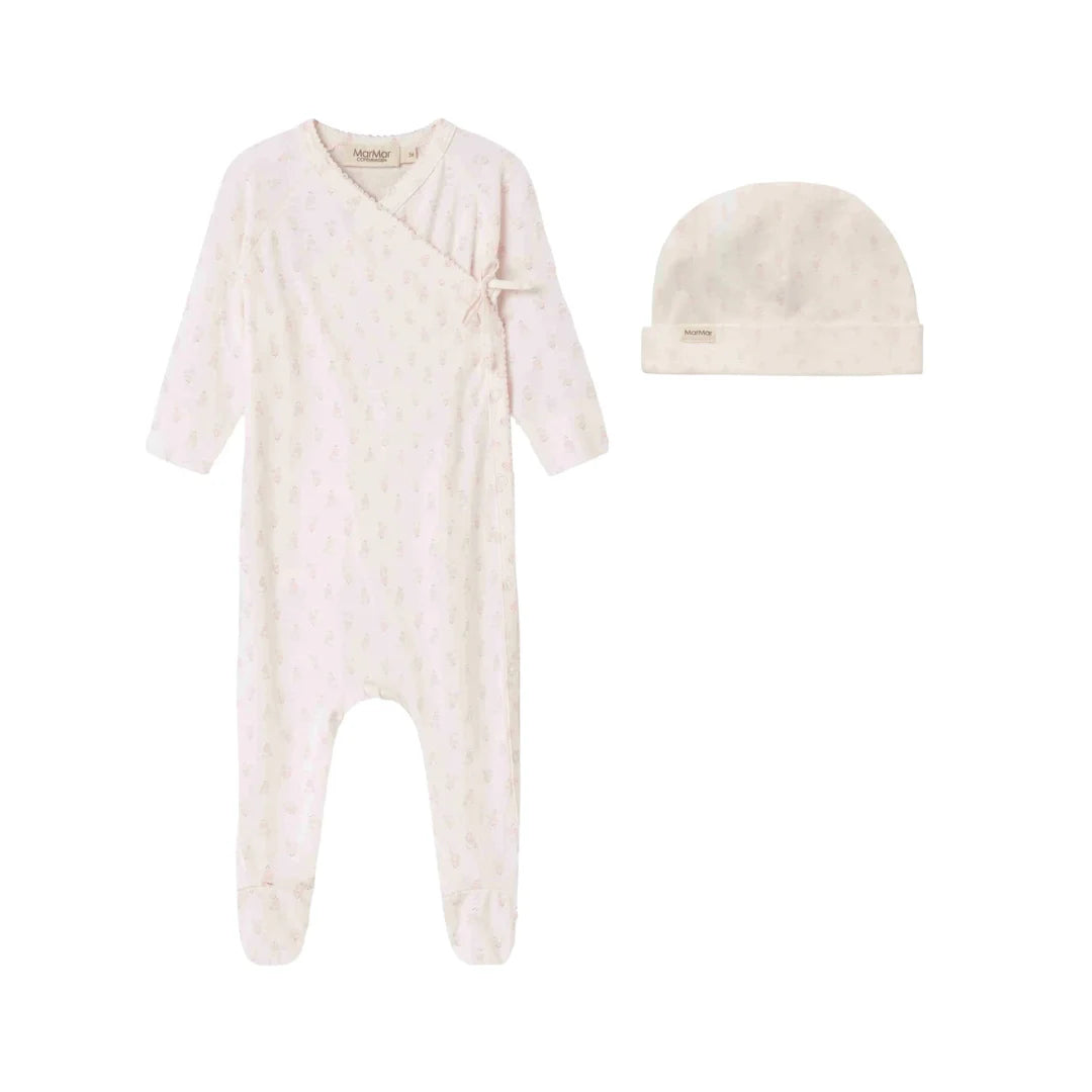 A front view of the MarMar Copenhagen mini bloom floral rubetta footie and matching baby hat.