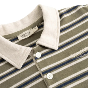 Close-up of a striped polo shirt collar and upper chest. The shirt has an olive green body with white and navy blue horizontal stripes, a contrasting off-white collar, white buttons, and a visible MatMar Copenhagen brand label inside the collar.