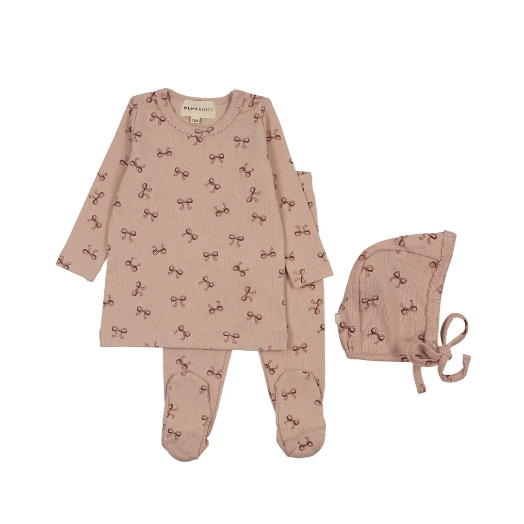 A front view of the Mema Knits pink bow print two-piece set and bonnet