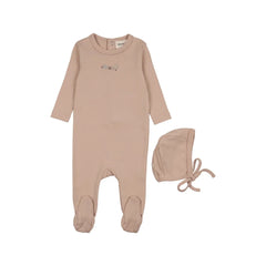 A front view of the Mema Knits floral embroidery footie and bonnet set in pink.