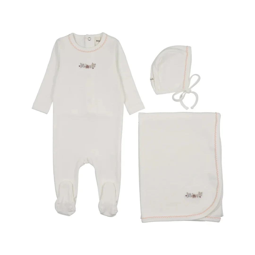 A front view of the Mema Knits white floral embroidery three-piece set.