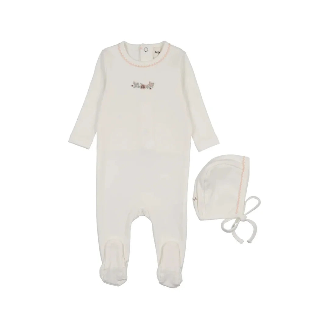 A front view of the Mema Knits white footie and bonnet set with pink floral embroidery.