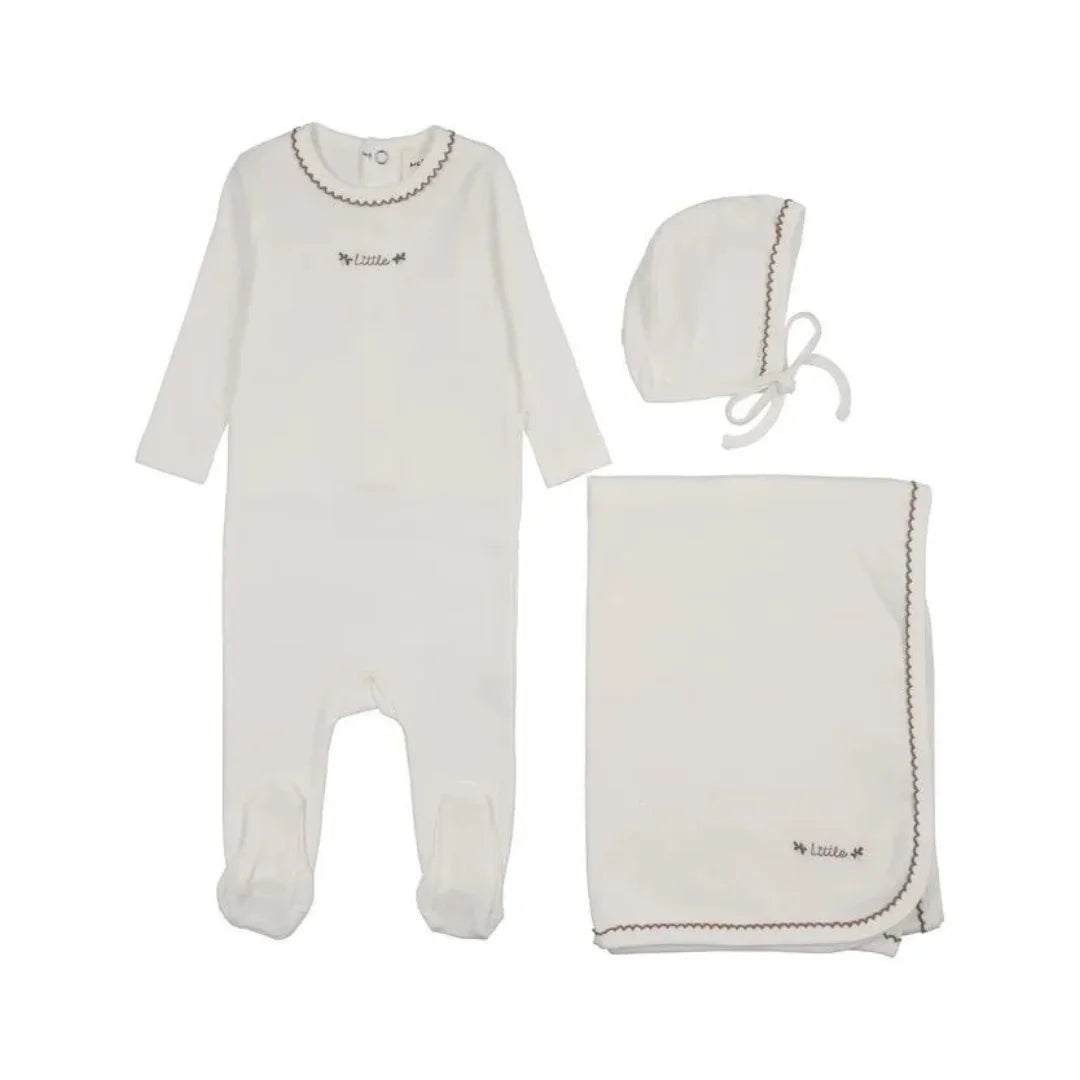 Mema knits footie set in a white box, featuring a pale pink silicone pacifier and a rose gold and cream beaded pacifier clip.