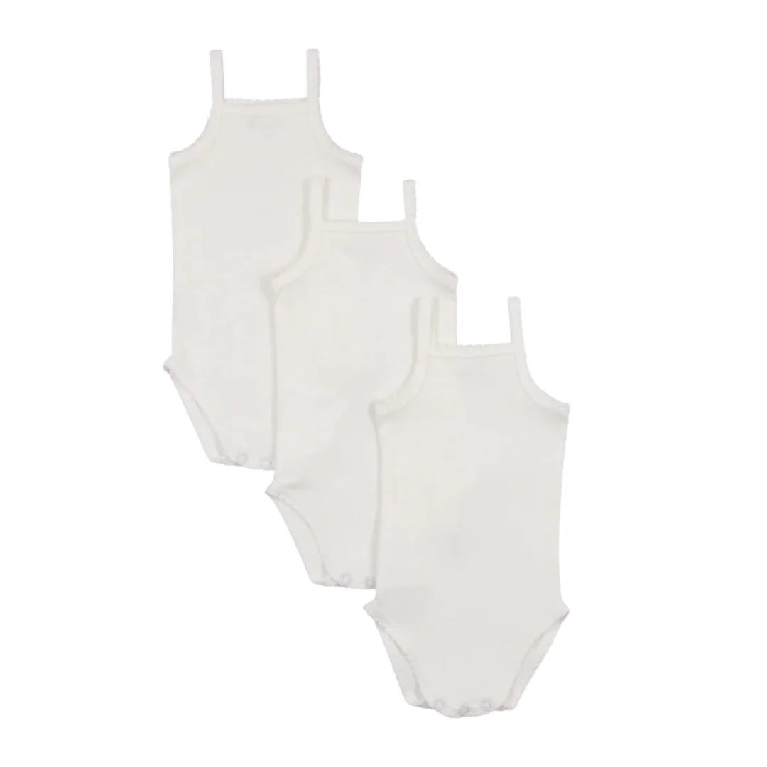 A flat-lay view of the Mema Knits white heart print pointelle undershirt.