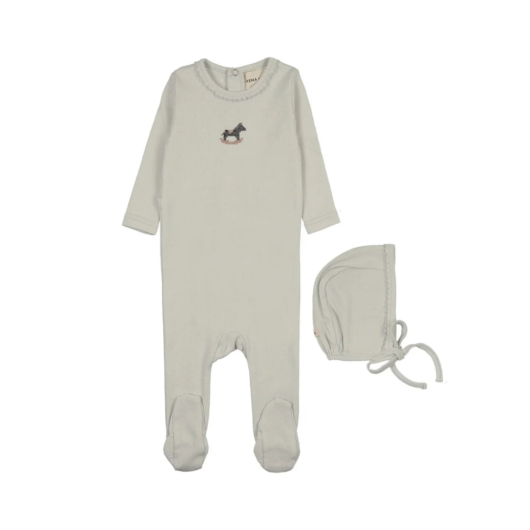 A flat-lay view of the Mema Knits grey dawn horse rocker footie and beanie set.