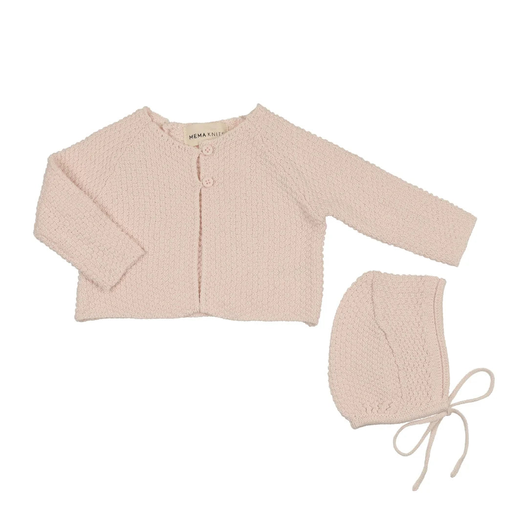 A front view of the Mema Knits knit cropped cardigan and matching bonnet set.