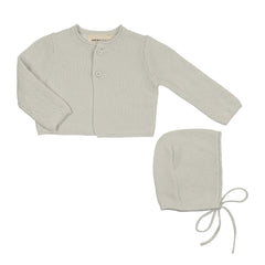 A front view of the Mema Knits knit cropped cardigan and matching bonnet set ice blue