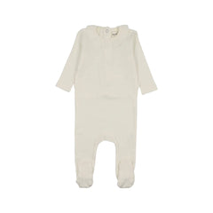 A front view of the Mema Knits ivory rib ruffle collar footie.