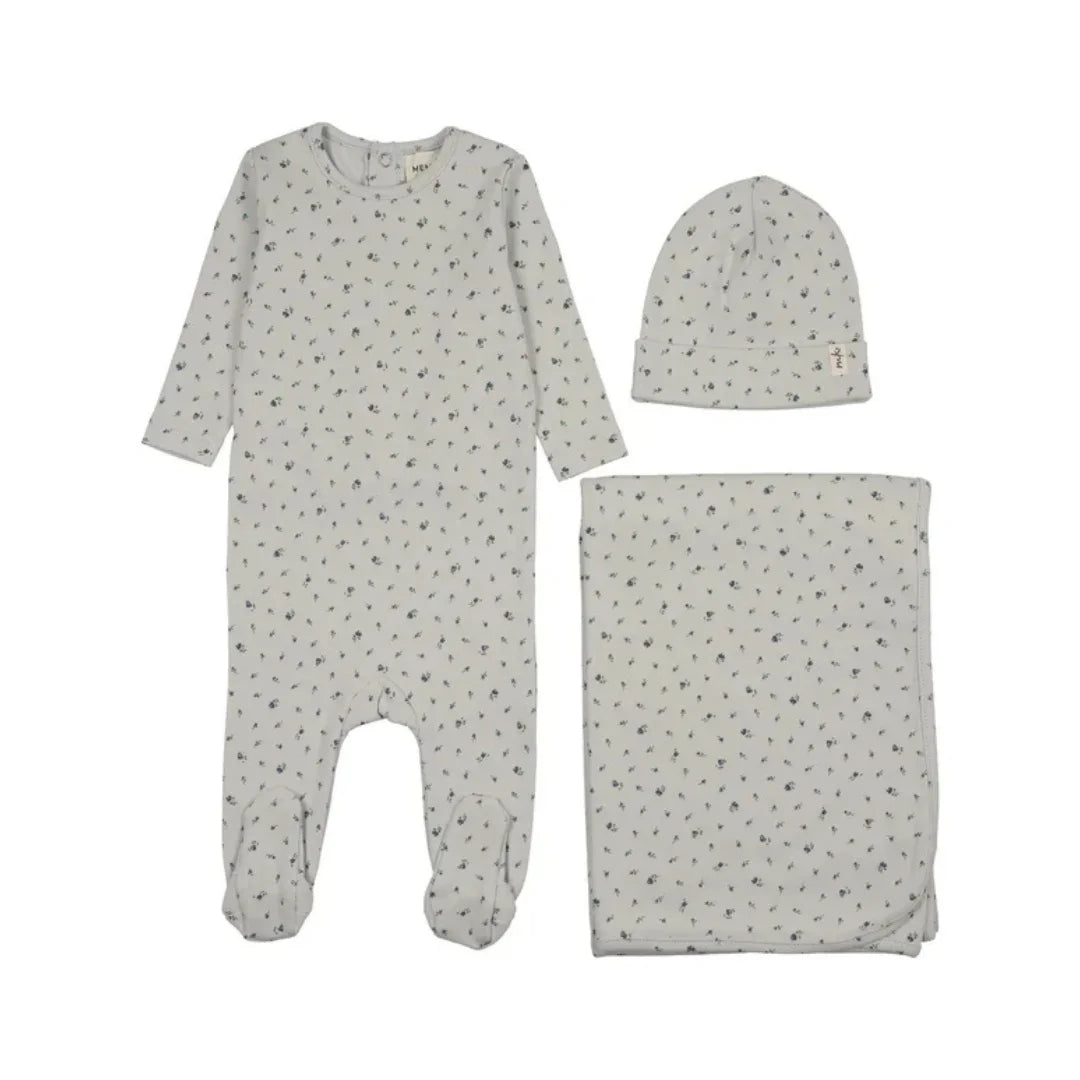 A flat-lay view of the Mema Knits blue floral printed snap back footie 3-piece set.