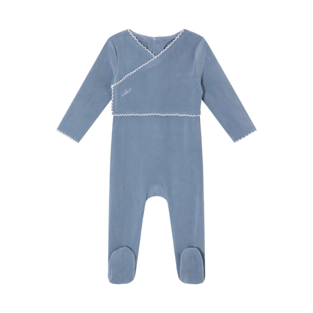 A front view of the Mini Label boys blue classic velour footie.