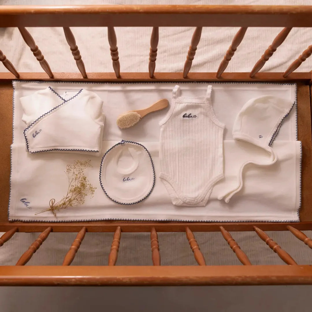 A high-resolution close-up highlighting the soft white velour fabric texture and finishing.