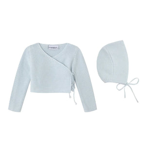 A front view of the Mini Label boys wrap cardigan and bonnet in blue.