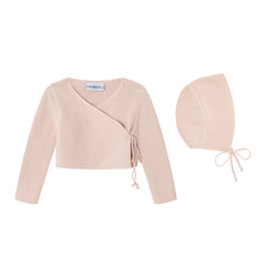 A front view of the Mini Label girls wrap cardigan and bonnet in pink.