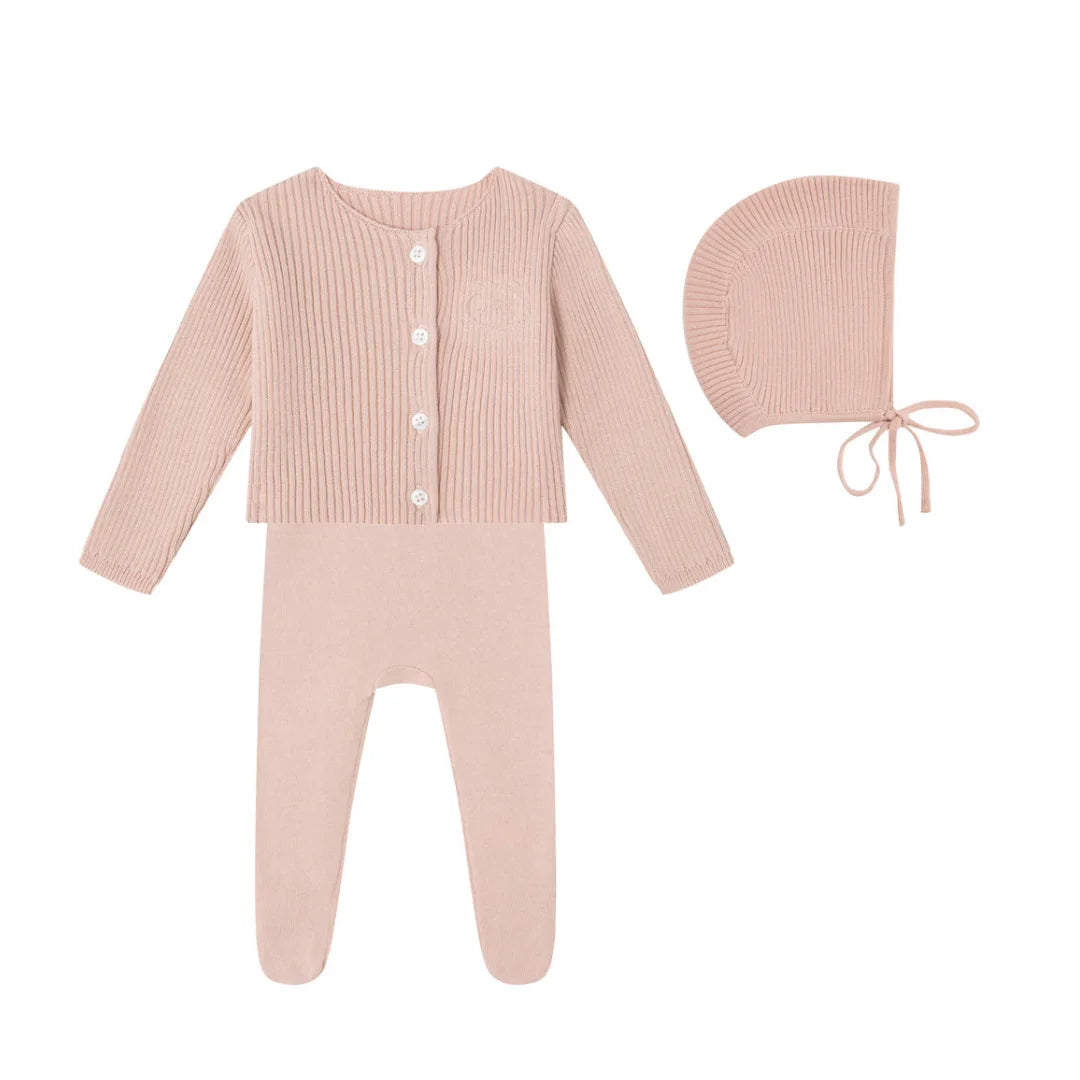 A front view of the Mini Label pink embossed emblem knit footie 4-piece set box.