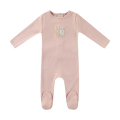 A front view of the Mini Label pink sherpa baby footie with bunny ears.