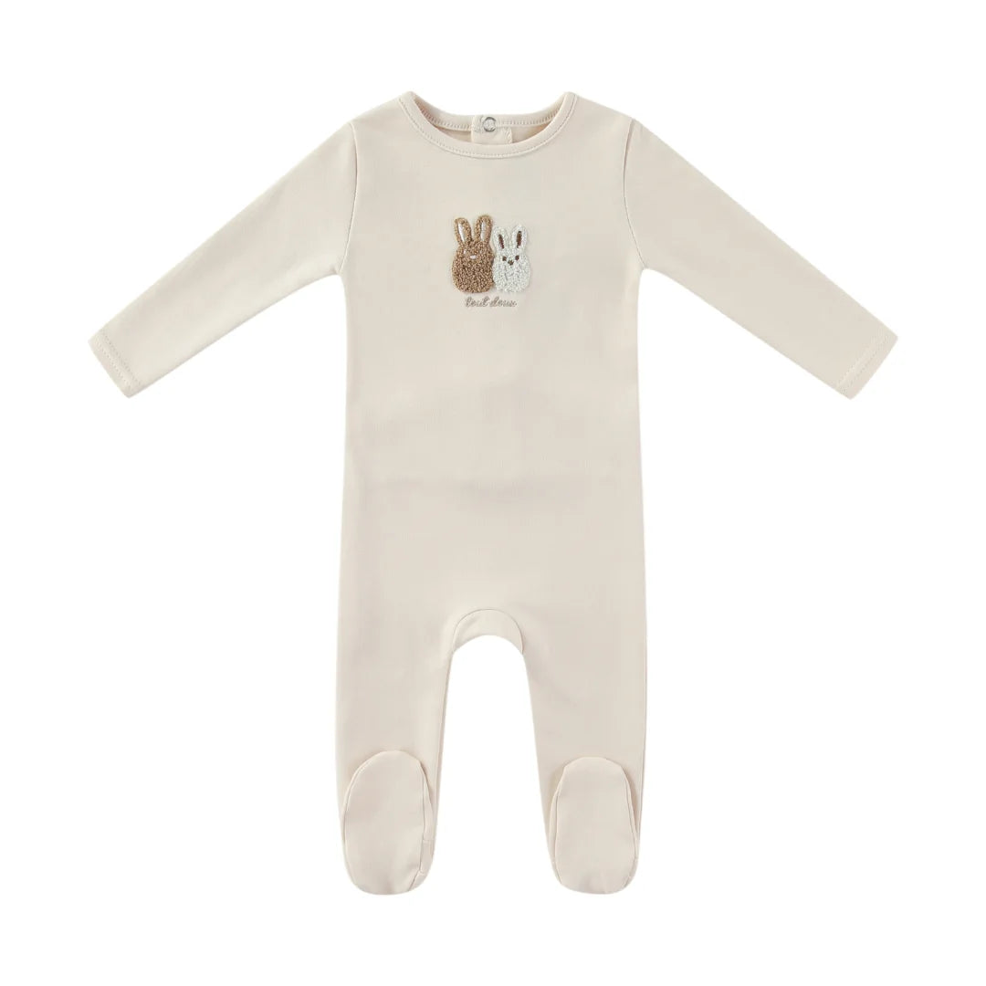 A front view of the Mini Label taupe sherpa baby footie with bunny ears.