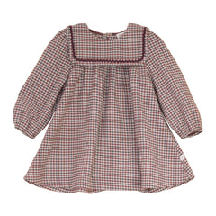 A front view of the Mini P burgundy velvet holiday dress with rick rack trim.