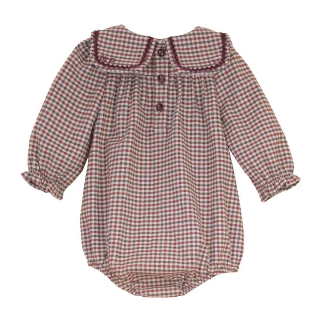 The clean back view of the luxury children's designer velvet romper.