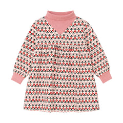 A front view of the Mini P cream and red printed corduroy dress for infants and toddlers.