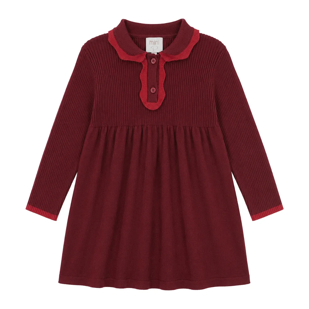 A front view of the Mini P red tonal knit baby dress.