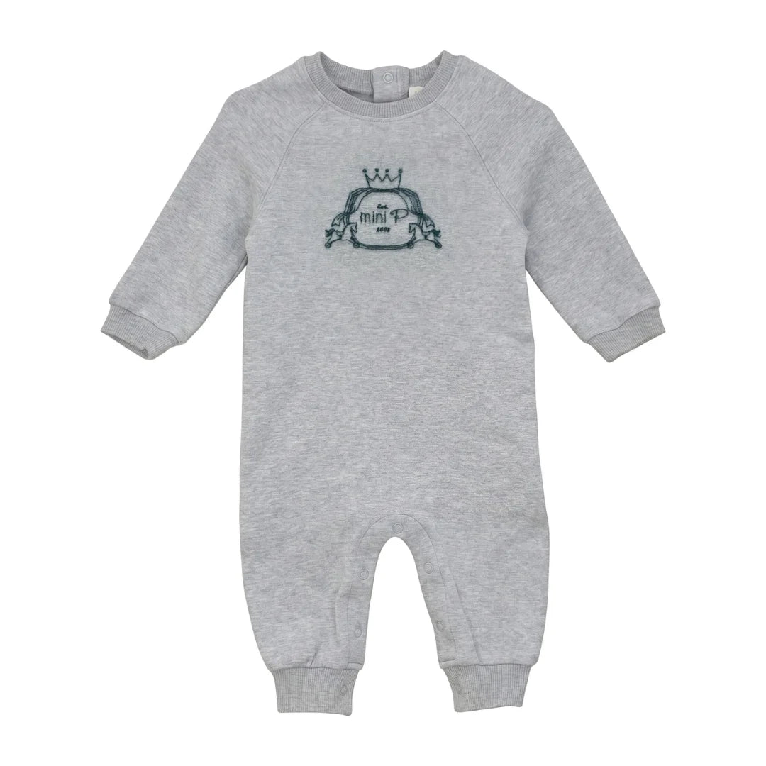 A front view of the Mini P grey and teal onesie with velvet emblem.