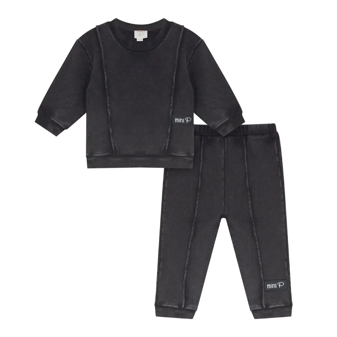 A front view of the Mini P black washed sweatshirt and pant set with piping detail.