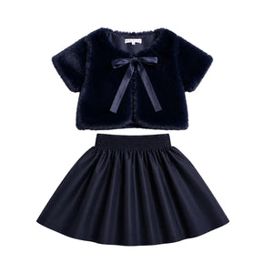 A front view of the Mode Avant 2-piece girls' faux fur shrug and taffeta skirt set.