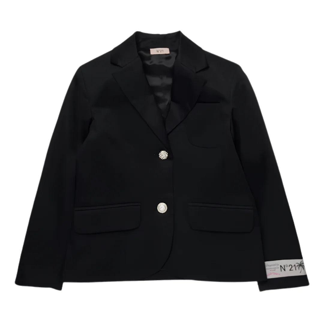 A front view of the structured N°21 Kids black blazer with an embroidered logo patch.