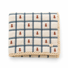 A flat-lay view of the New Grain Teddy Bluebelle keepsake quilt.