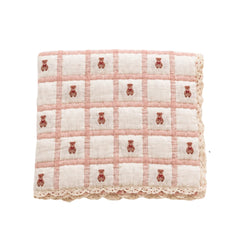 A flat-lay view of the New Grain Teddy Petal keepsake quilt.