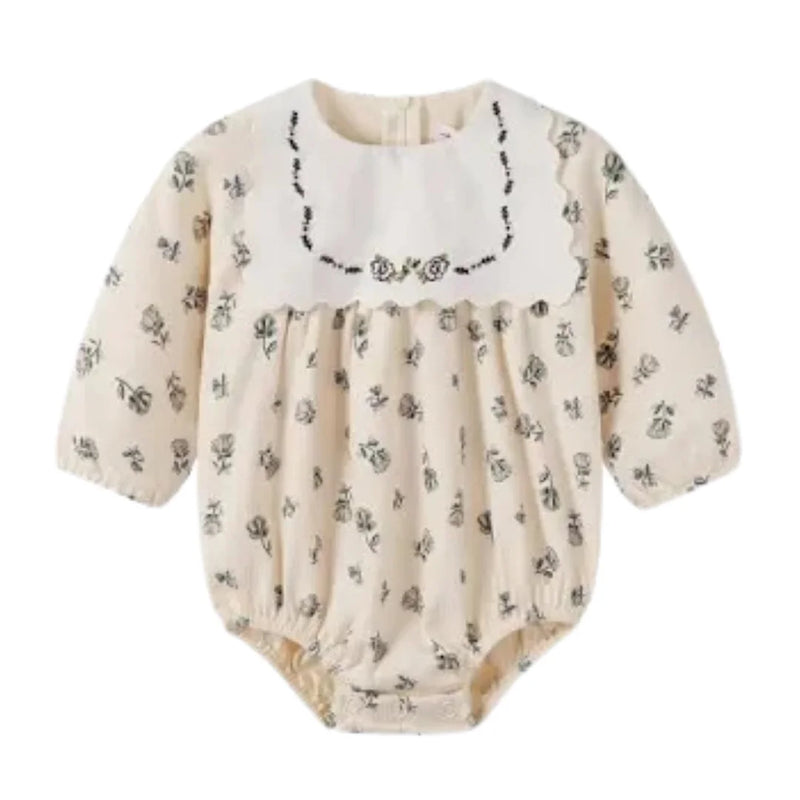 A front view of the Nou Nelle cream corduroy baby romper.