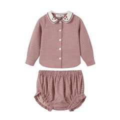 A front view of the Nou Nelle pink houndstooth baby bloomer set.