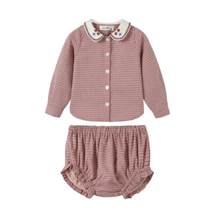 A front view of the Nou Nelle pink houndstooth baby bloomer set.