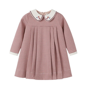 A front view of the Nou Nelle pink houndstooth dress for children.