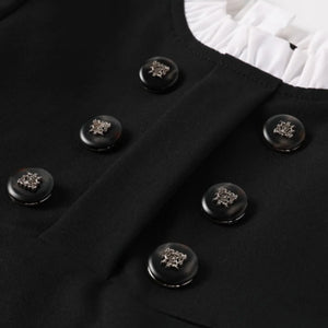 A high-resolution close-up of the smooth taffeta fabric texture and button details.