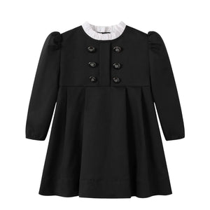 A front view of the Nou Nelle black taffeta double-breasted dress for children.