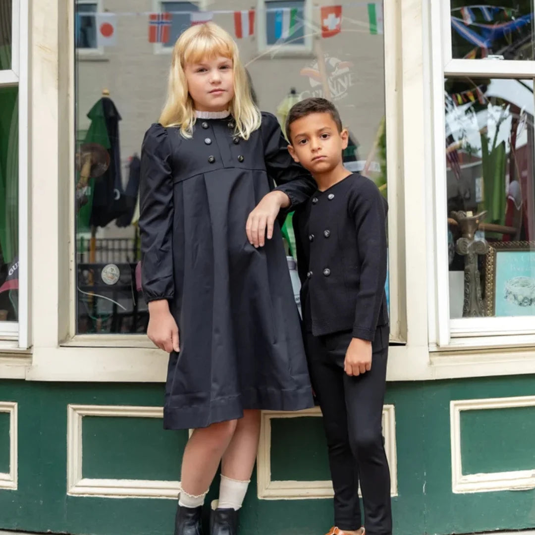 A child wearing the Nou Nelle black taffeta dress 