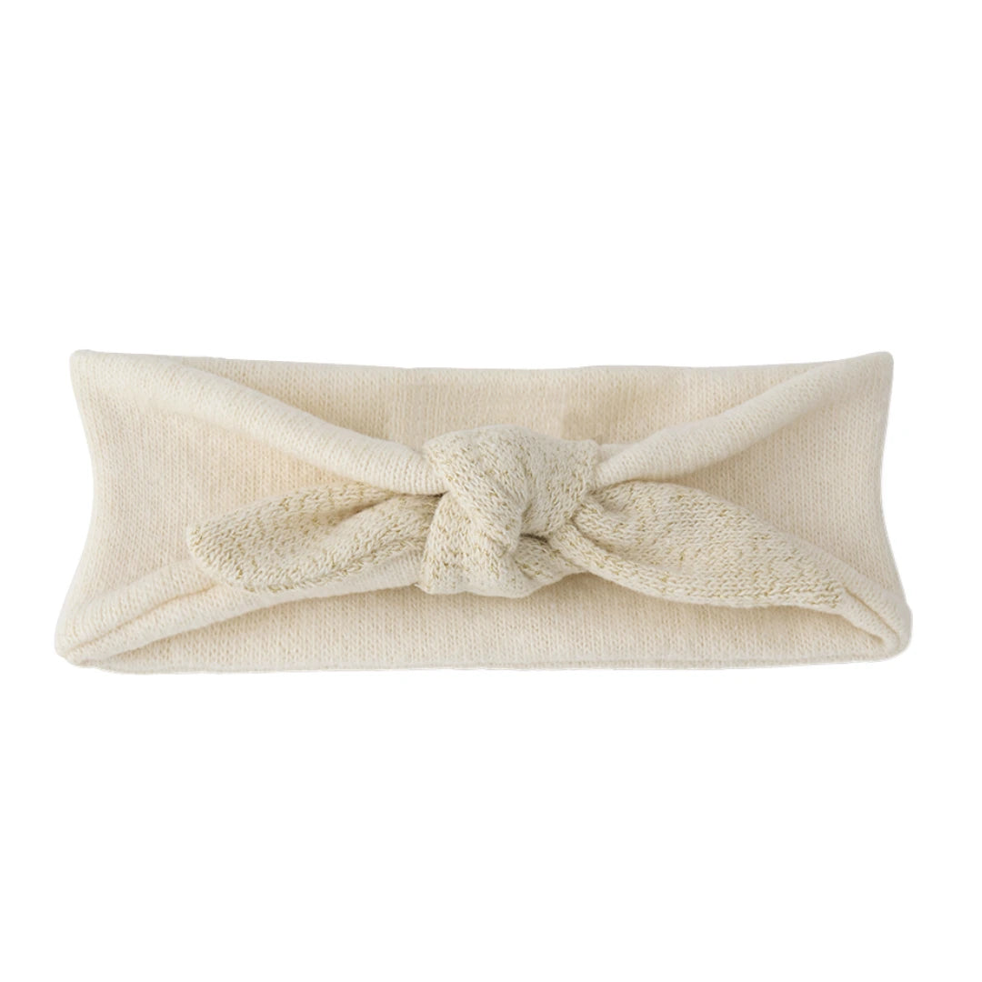 A breathtaking 1+ in the Family Ajaccio Knit Head Wrap in Ecru, showcasing its authoritative architectural knot and refined Spanish knit texture.