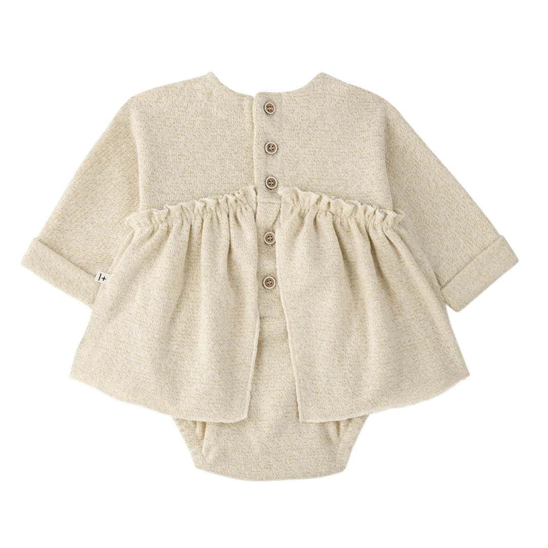 A breathtaking 1+ in the Family Conques Dress in Ecru, featuring an integrated bodysuit and an authoritative architectural Spanish knit silhouette.