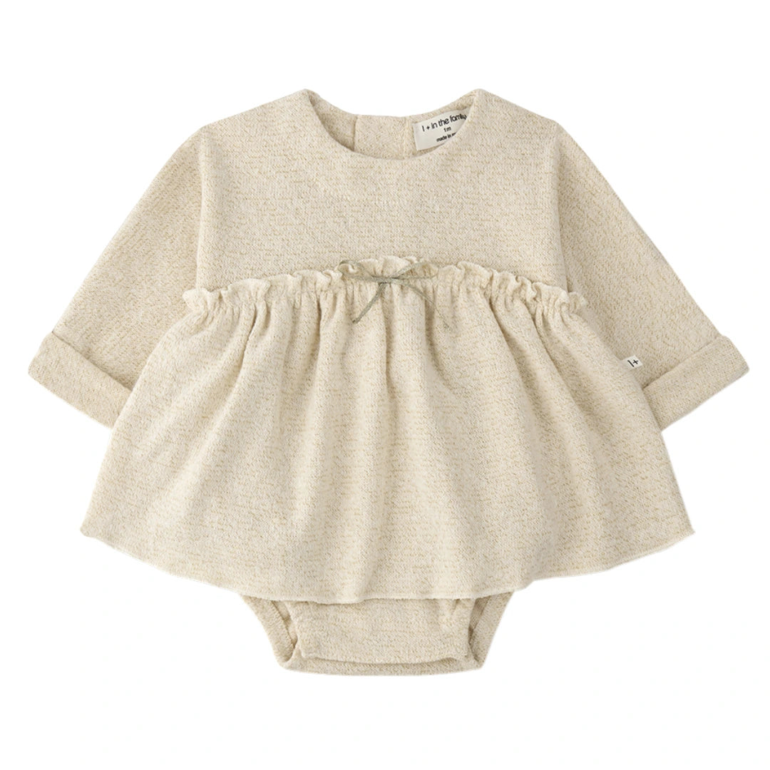 A breathtaking 1+ in the Family Conques Dress in Ecru, featuring an integrated body and an authoritative architectural Spanish knit silhouette.