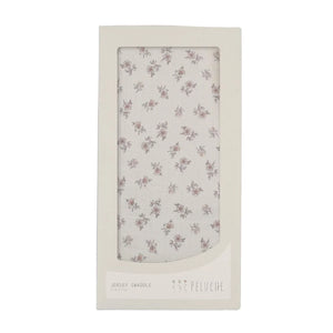 A front view of the Peluche Bebe blossom swaddle blanket in rose.