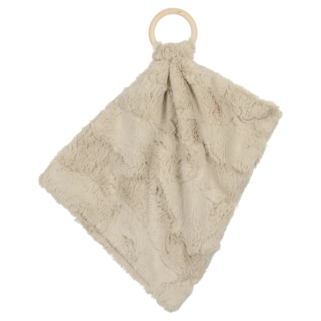 A sophisticated Peluche Bebe Mini Lux Fur Teether featuring a soft champagne plush fabric looped through a smooth, architectural wooden ring.