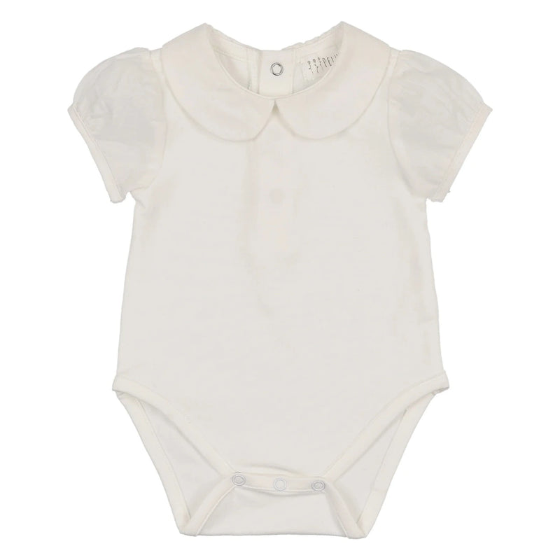 A sophisticated Peluche Bebe onesie in soft white, showcasing the breathtaking architectural puff sleeves and premium cotton texture.