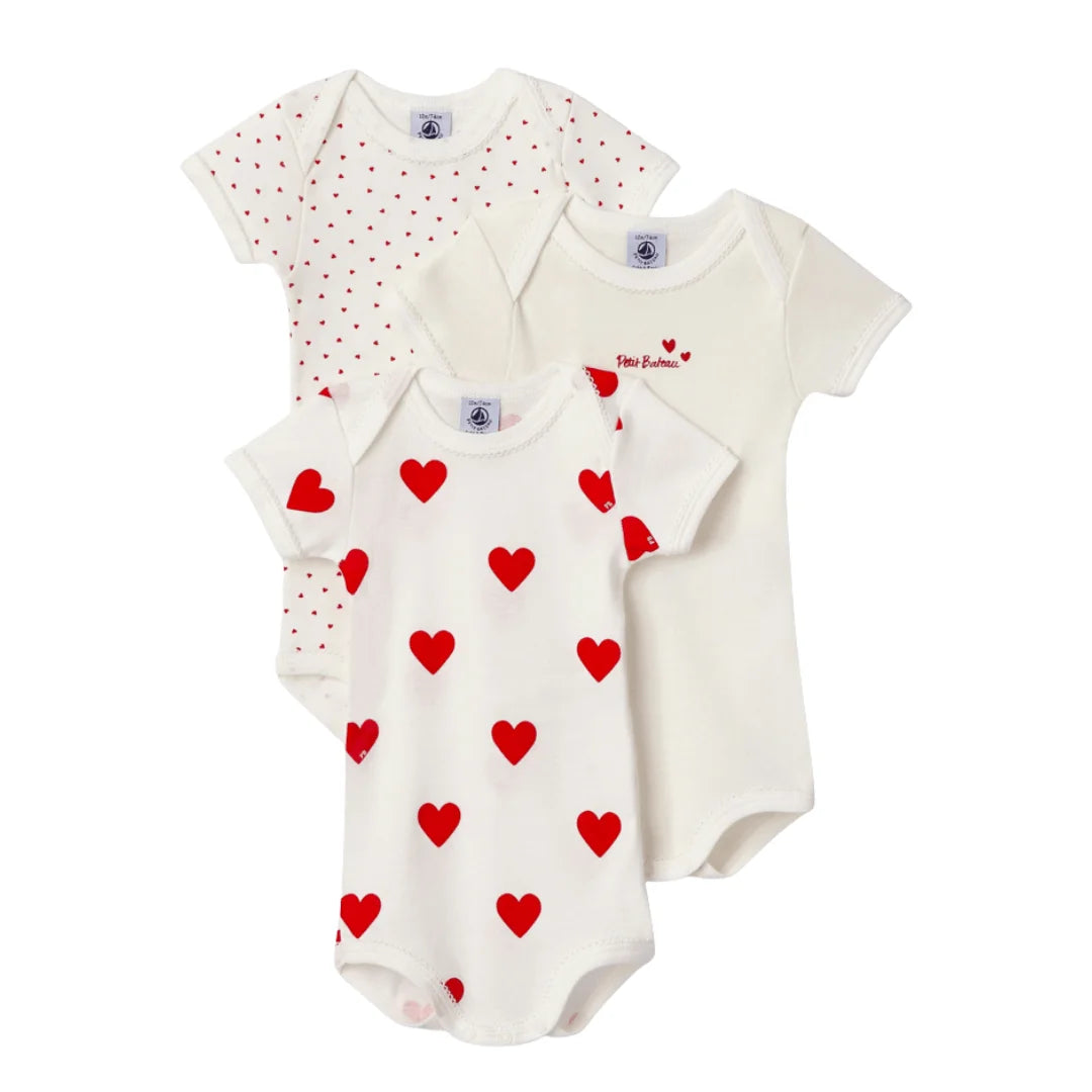 A breathtaking Petit Bateau 3-Pack Bodysuit Set featuring immaculate heart prints in a curated white and red palette.