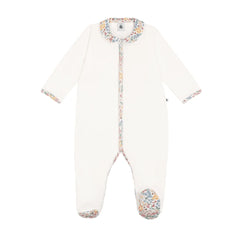 A front view of the Petit Bateau three-piece baby set showcasing the bodysuit, floral print cardigan, and cream pants.