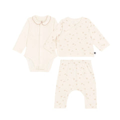 A front view of the Petit Bateau three-piece baby set showcasing the bodysuit, floral print cardigan, and cream pants.