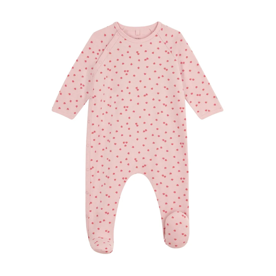 A front view of the Petit Bateau baby girl footie featuring an apple print and side snaps.