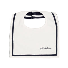 White bib with navy trim and 'petit bateau' branding on a white background