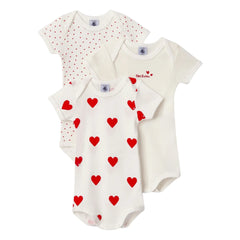 Three baby bodysuits with different patterns on a white background