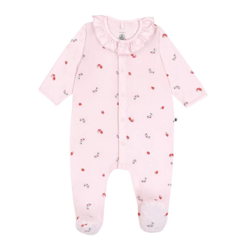A front view of the Petit Bateau footie featuring a cheerful berry print and front snaps.